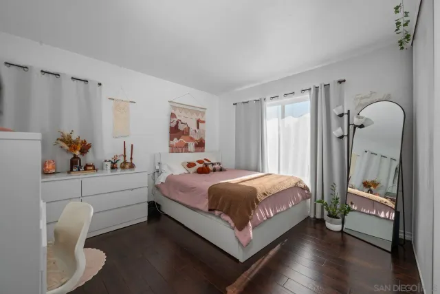 a bed room with a bed and a window