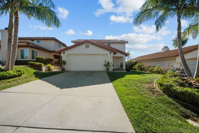 front view of a house with a garden