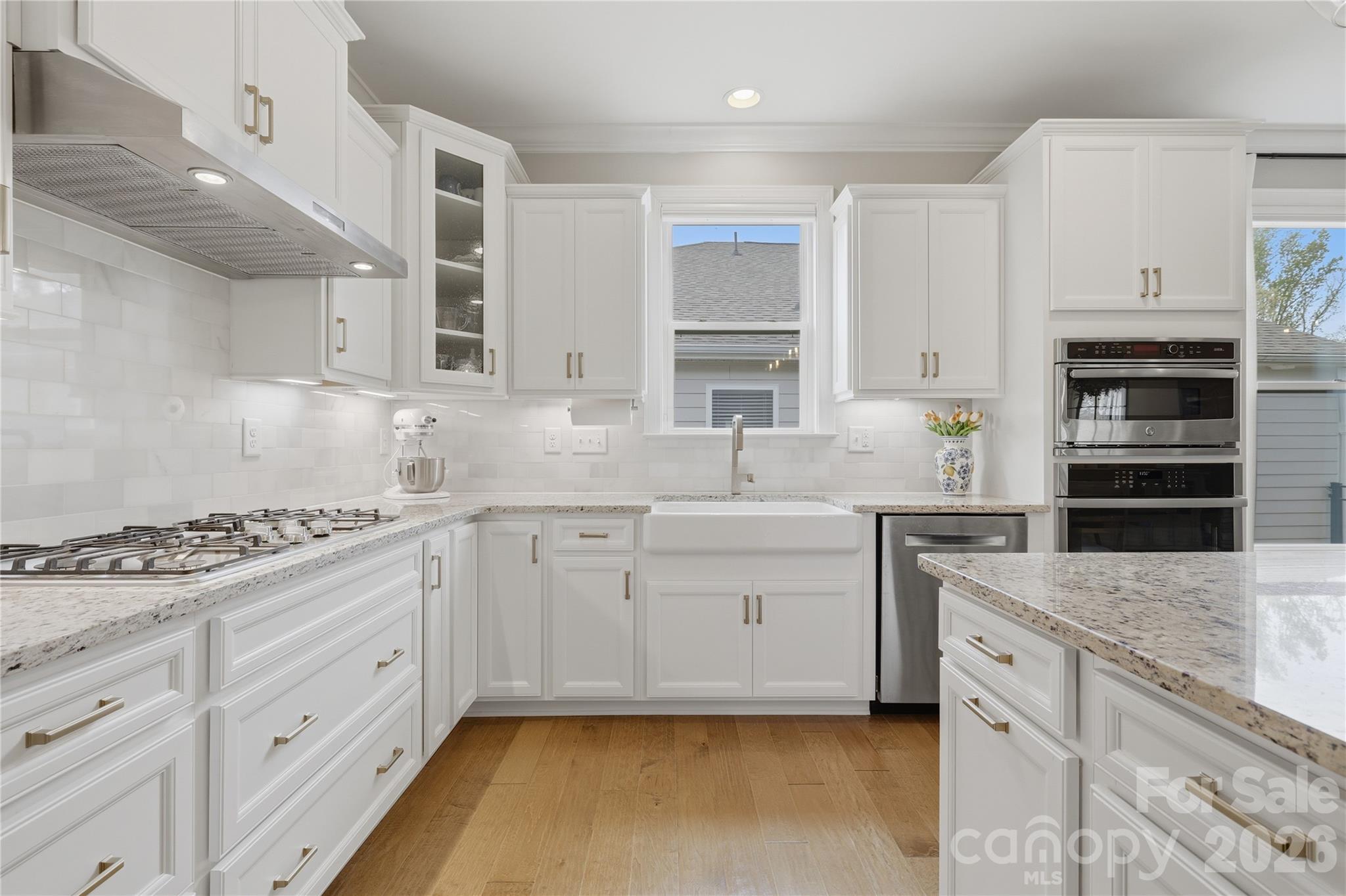 3023 Eagle Ridge Lane Indian Trail, NC 28079 - Photo 11 of 47 a kitchen with granite countertop a sink stainless steel appliances and cabinets