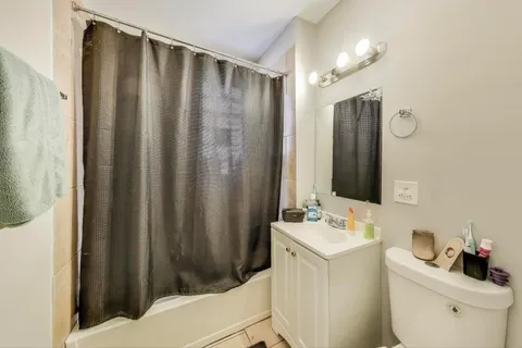 a bathroom with a sink a toilet and mirror