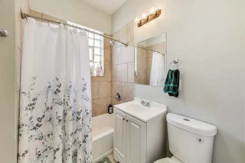 a view of a swimming pool and deck in the backyard