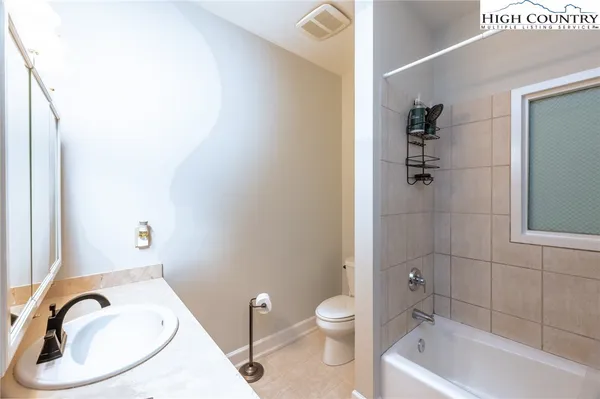 a view of a chairs and table in the balcony