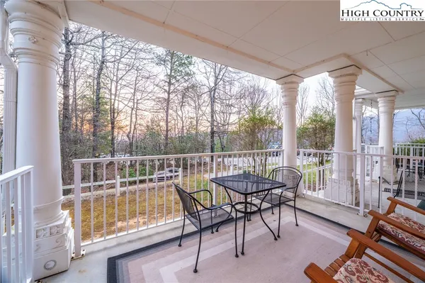 a view of a two chairs in the balcony