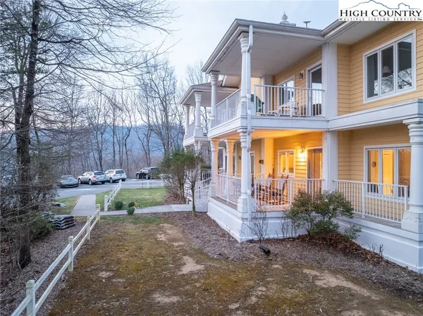 a sign that is on a brick wall with a couple of people