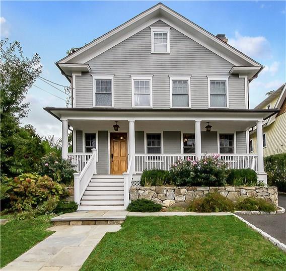 35 Orchard Place Greenwich, CT 06830 - Photo 1 of 1 a front view of a house with a yard