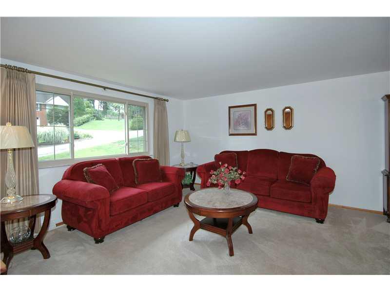 130 Easley Road Pittsburgh, PA 15237 - Photo 4 of 22 Living Room. Huge bay window in living room. Newer windows throughout home. Fresh paint. Hardwood flooring underneath carpet on main level.