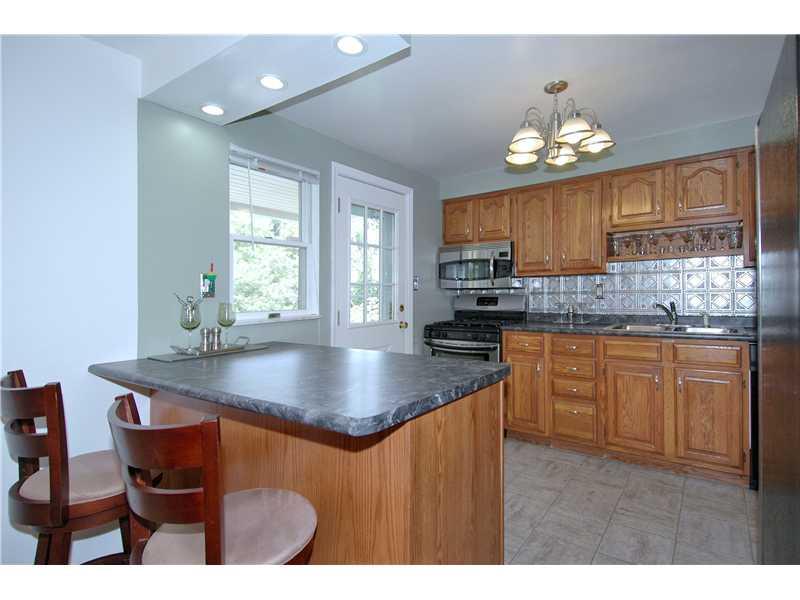 130 Easley Road Pittsburgh, PA 15237 - Photo 6 of 22 Kitchen. Fabulous oak kitchen has updated appliances, counters, floor, metallic backsplash, lighting.