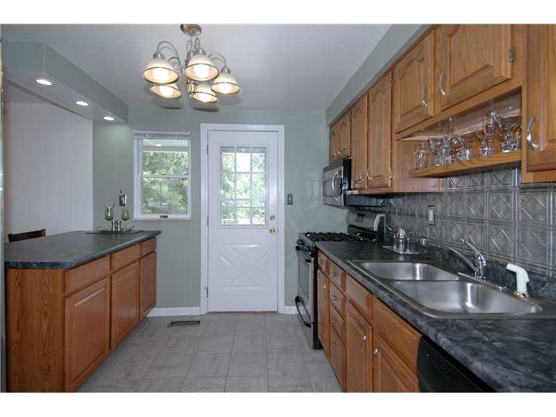 130 Easley Road Pittsburgh, PA 15237 - Photo 7 of 22 Kitchen. Kitchen door opens to the expansive covered balcony for outdoor dining and entertainment.
