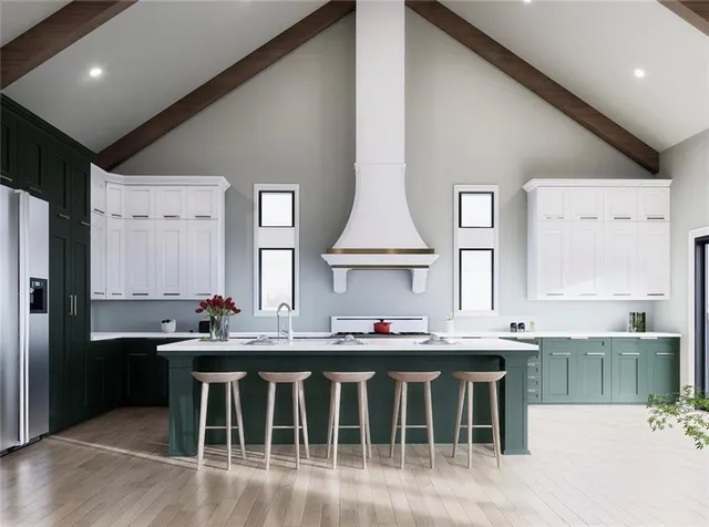 a dining hall with stainless steel appliances kitchen island granite countertop a sink and cabinets