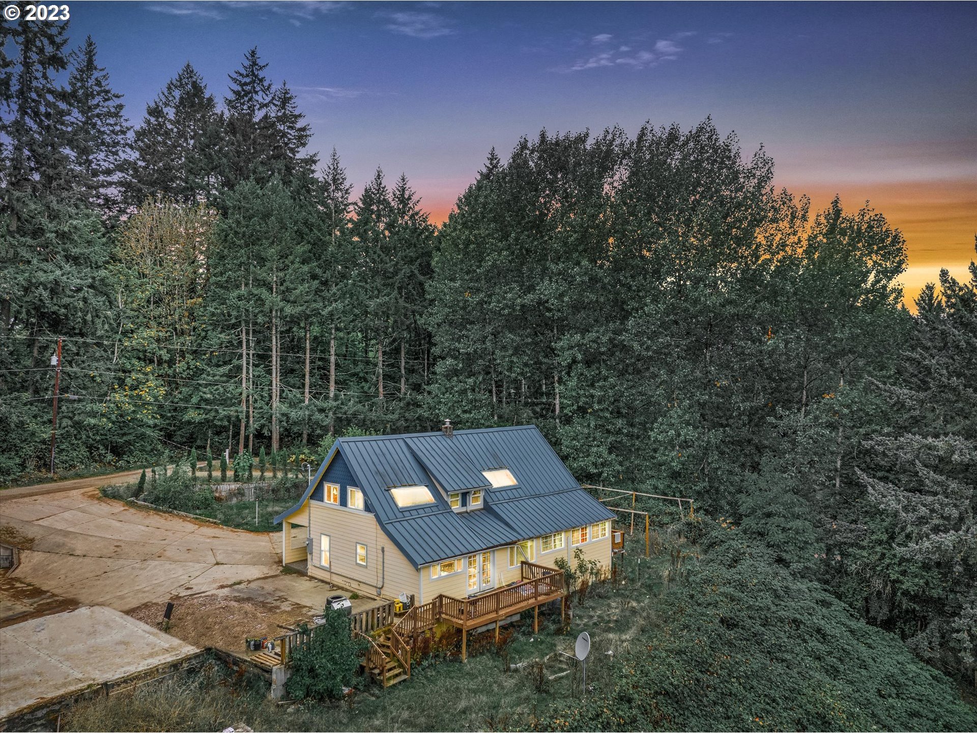 6160 Northwest Kiacut Road Gaston, OR 97119 - Photo 1 of 18 a view of a trees and barn in the back yard