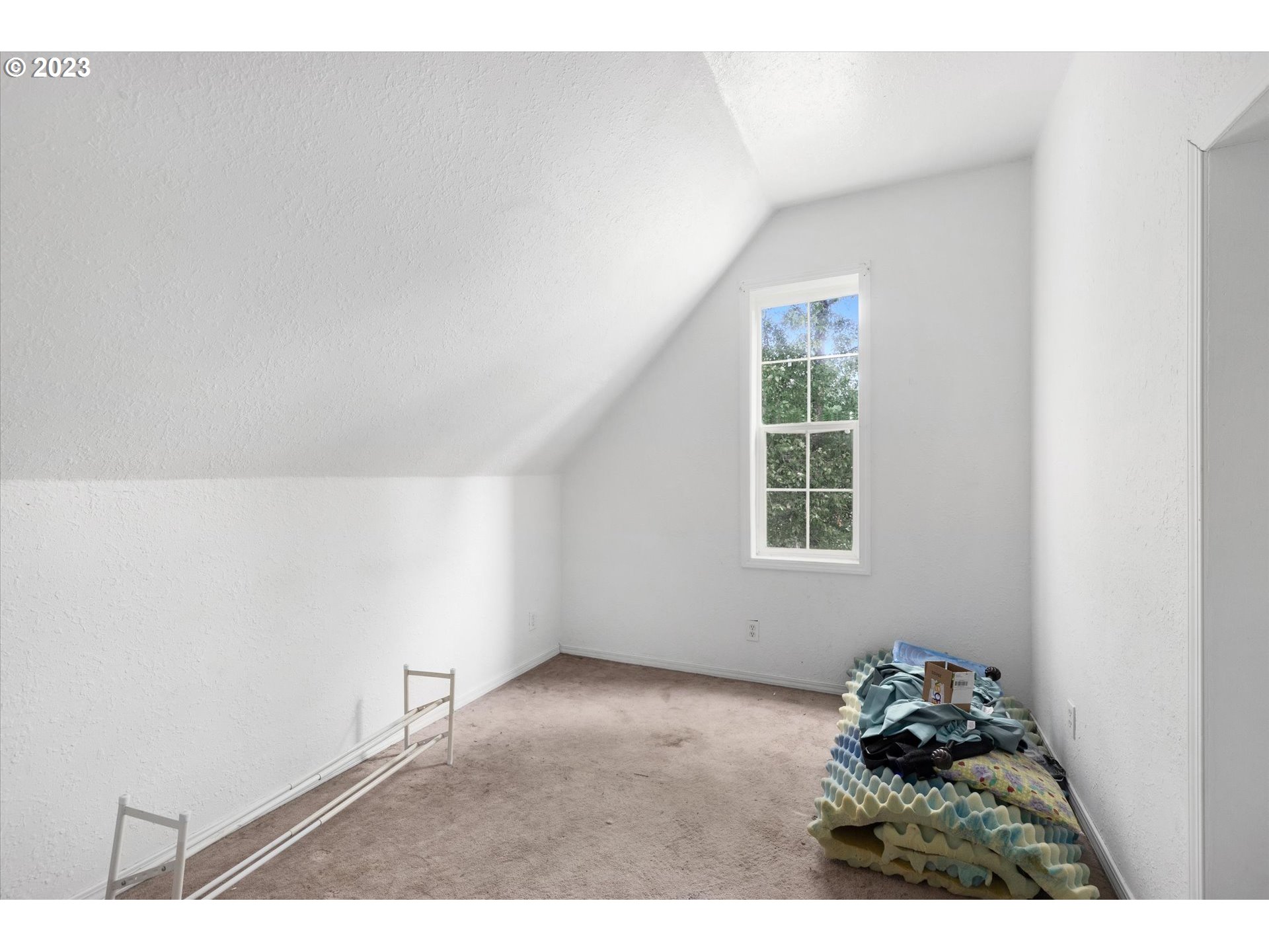 6160 Northwest Kiacut Road Gaston, OR 97119 - Photo 13 of 18 a view of a room that has a window in it