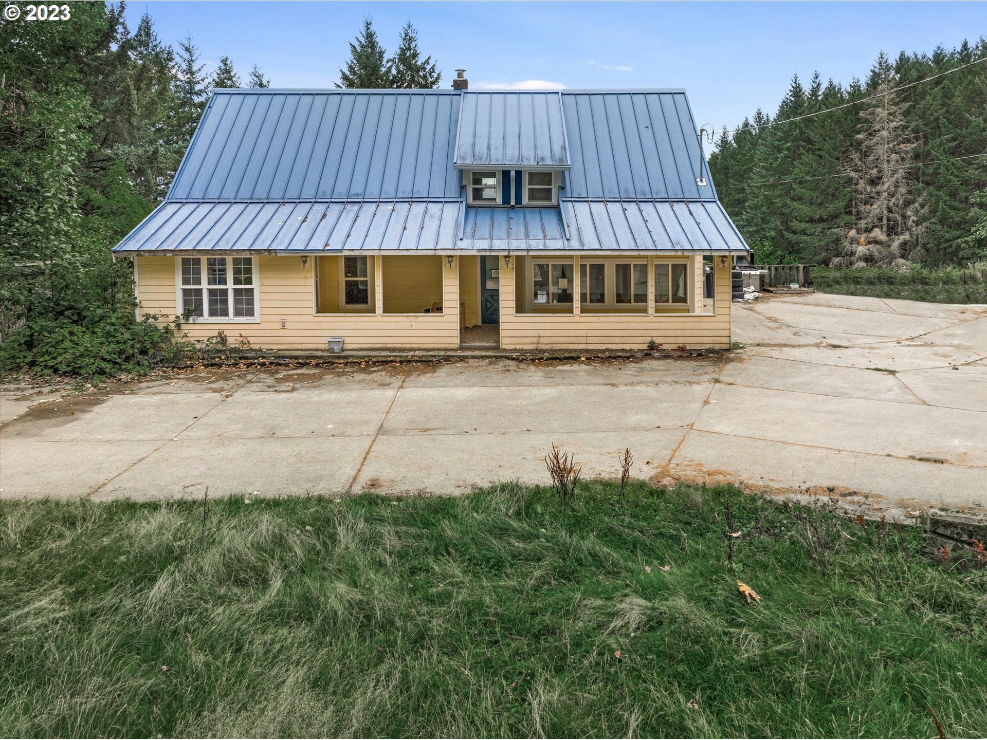 6160 Northwest Kiacut Road Gaston, OR 97119 - Photo 16 of 18 a view of a house with a yard