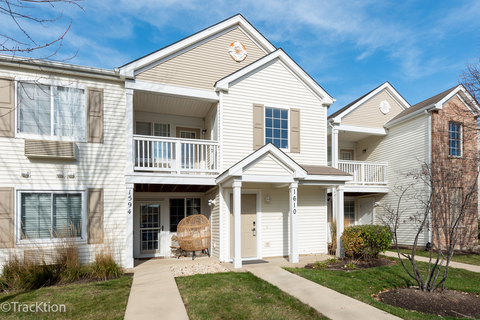 1610 McClure Road, Unit 1610 Aurora, IL 60505 - Photo 1 of 16 a front view of a house with a yard