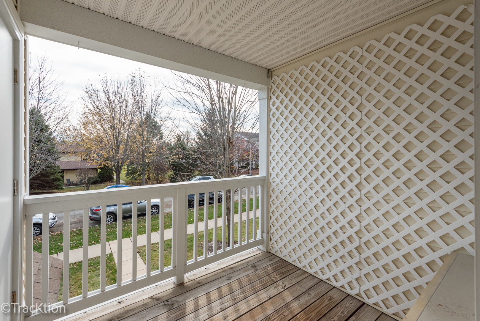1610 McClure Road, Unit 1610 Aurora, IL 60505 - Photo 12 of 16 a view of a balcony with wooden fence