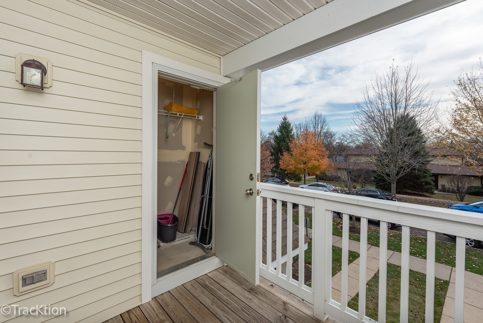 1610 McClure Road, Unit 1610 Aurora, IL 60505 - Photo 13 of 16 a view of a porch with wooden floor and fence