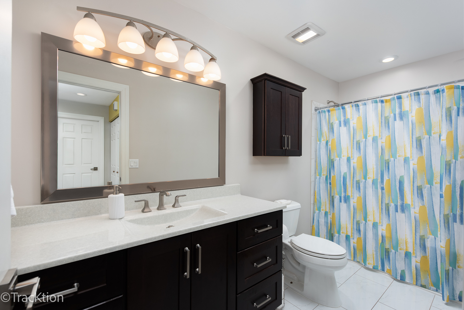 1610 McClure Road, Unit 1610 Aurora, IL 60505 - Photo 10 of 16 a bathroom with a sink vanity mirror and toilet