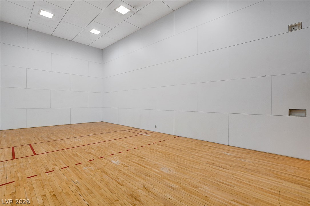 230 East Flamingo Road, Unit 106 Las Vegas, NV 89169 - Photo 52 of 66 Engage in active living with this dedicated indoor sport court, featuring polished hardwood floors and high ceilings.