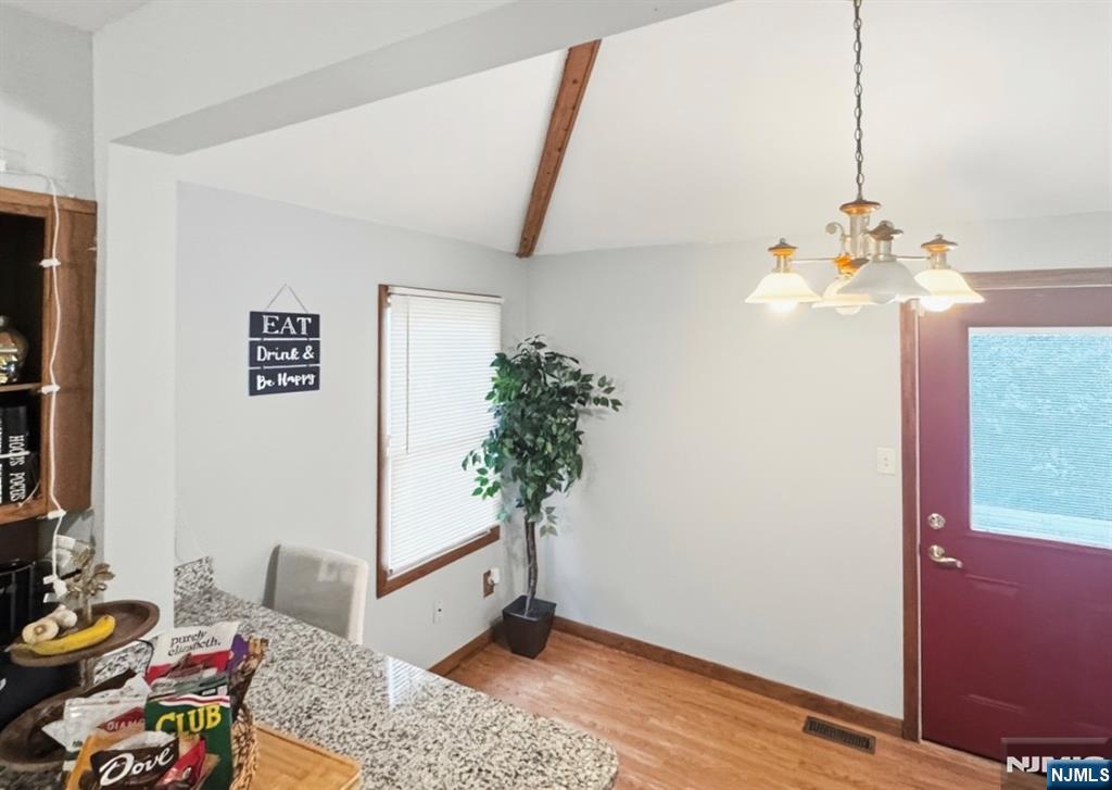 68 Washington Avenue Rutherford, NJ 07070 - Photo 10 of 23 a living room with furniture and a potted plant