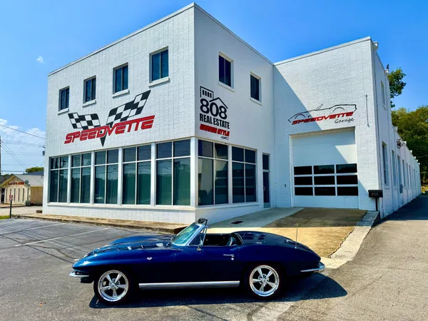 a car parked in front of a house