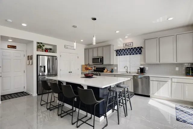 a view of a livingroom with furniture and staircase