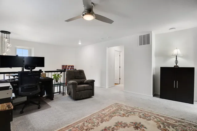 a bathroom with a granite countertop sink a large mirror and a shower