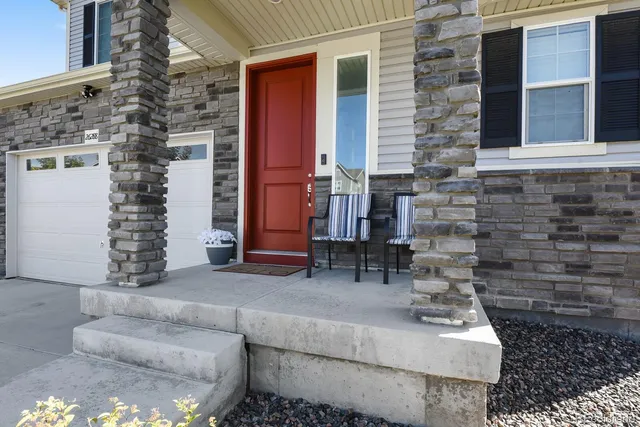 a view of house with couch and chairs