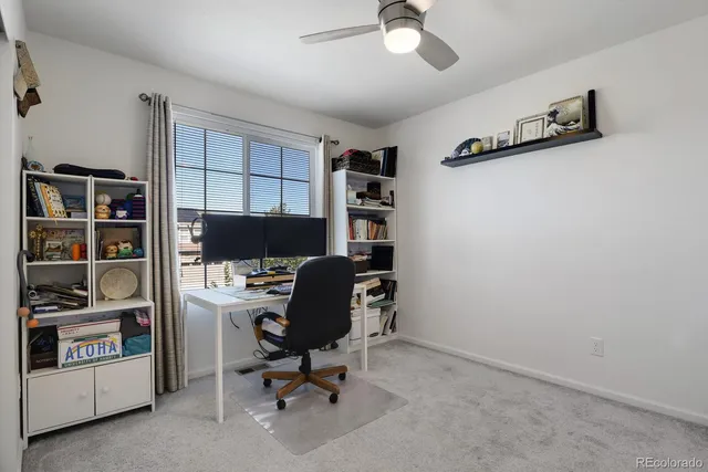 a bedroom with a bed and a lamp