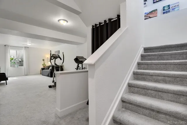 a front view of house with yard and outdoor seating