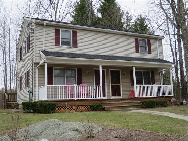 22 Lynch Road Wales, MA 01081 - Photo 1 of 11 a front view of a house with a garden