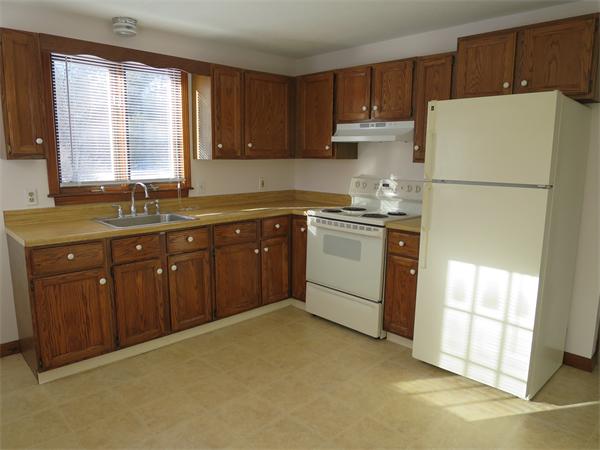 22 Lynch Road Wales, MA 01081 - Photo 3 of 11 a kitchen with stainless steel appliances granite countertop a refrigerator sink and cabinets