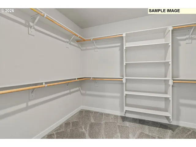 a view of an empty walk in closet