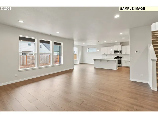 a view of kitchen with furniture and wooden floor