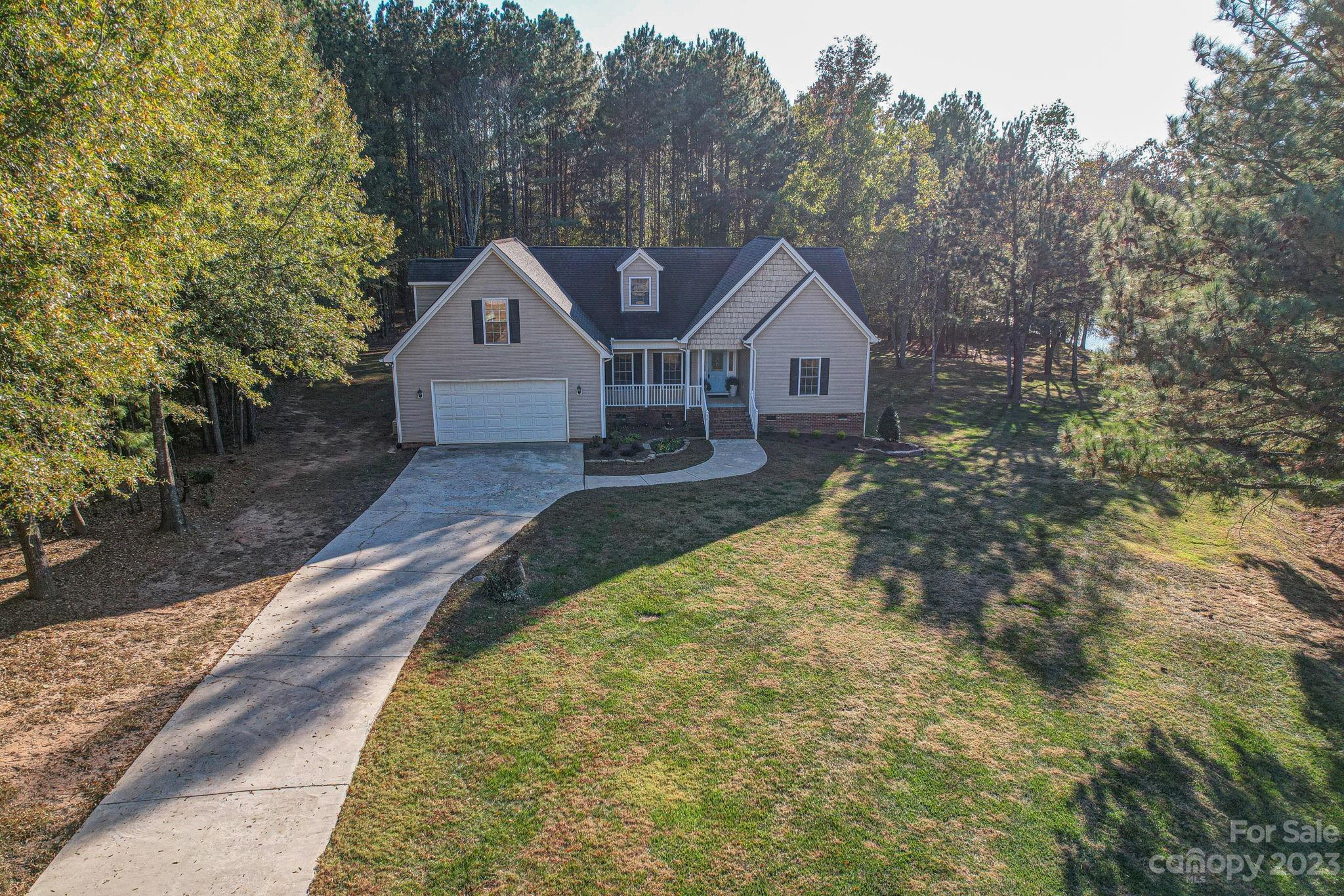 2011 Roadrunner Road Clover, SC 29710 - Photo 2 of 48 a front view of a house with a yard and large tree