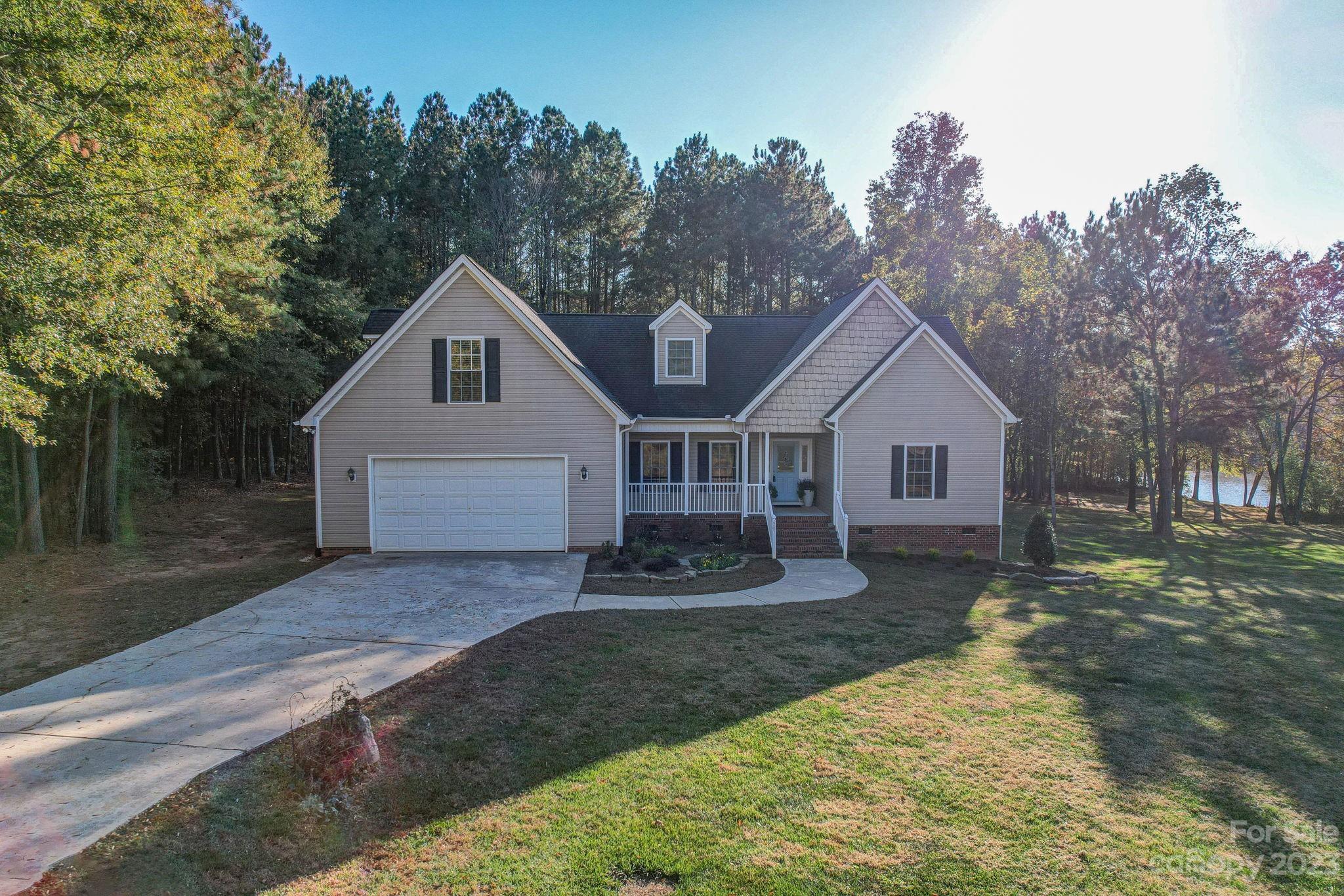 2011 Roadrunner Road Clover, SC 29710 - Photo 3 of 48 a front view of a house with a yard and trees