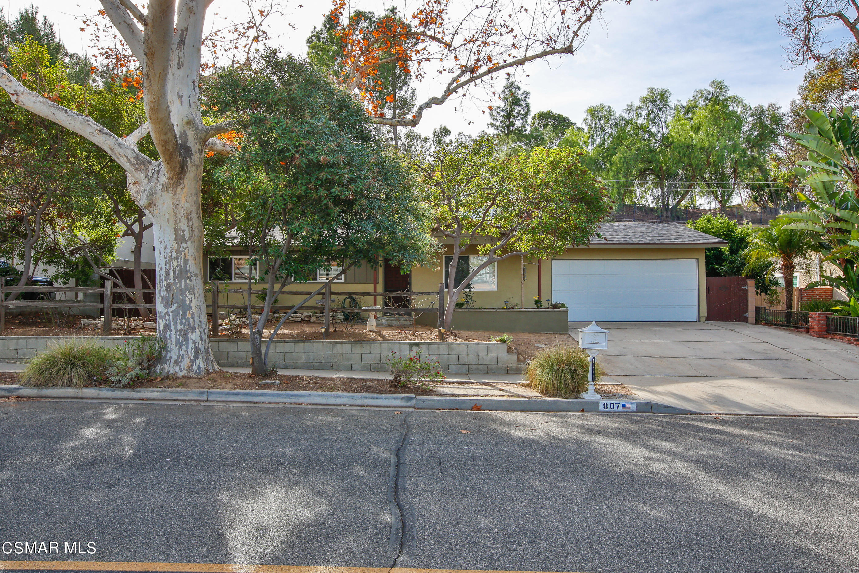 807 Talbert Avenue Simi Valley, CA 93065 - Photo 1 of 33 a front view of a house with a yard and garage