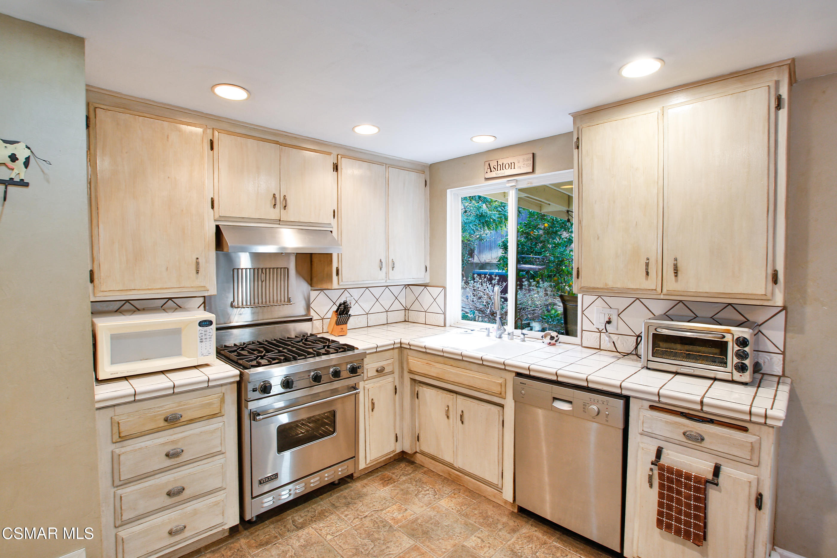 807 Talbert Avenue Simi Valley, CA 93065 - Photo 13 of 33 a kitchen with appliances a sink and cabinets