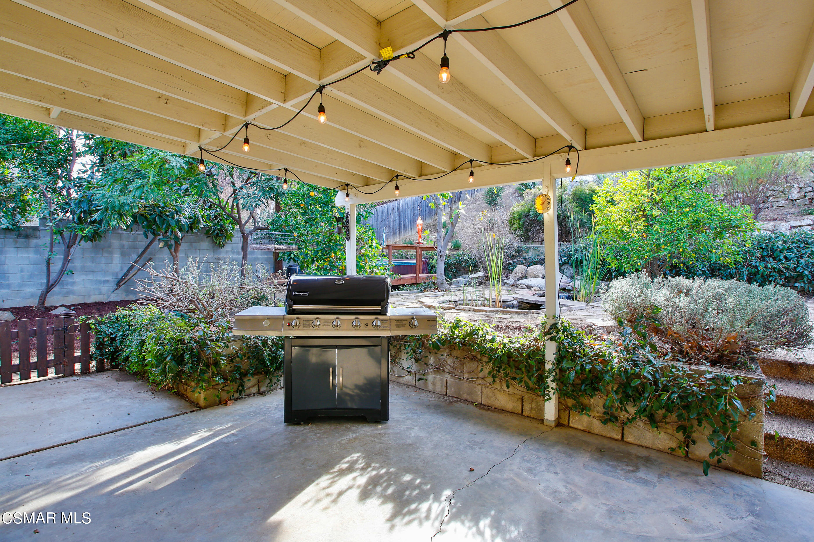 807 Talbert Avenue Simi Valley, CA 93065 - Photo 22 of 33 a view of a backyard with plants and a patio