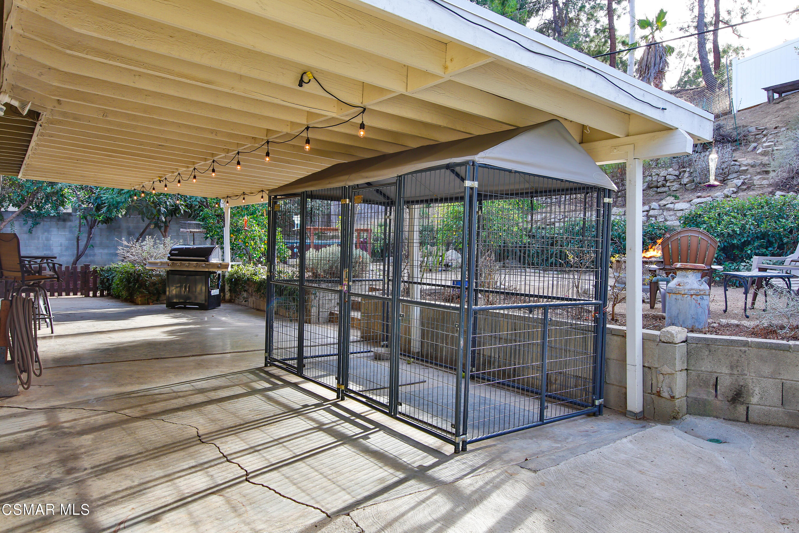 807 Talbert Avenue Simi Valley, CA 93065 - Photo 23 of 33 a view of a patio with table and chairs under an umbrella