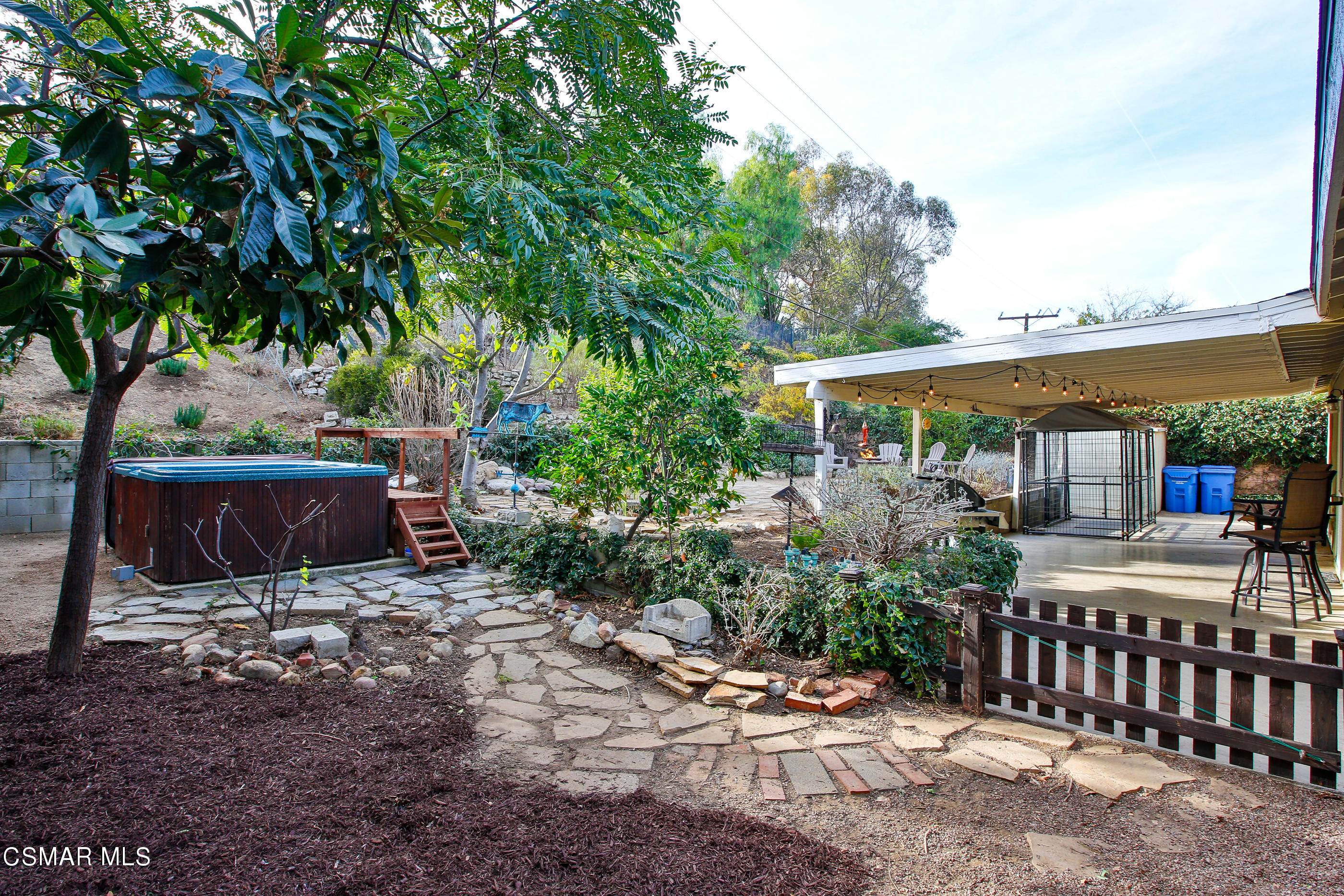 807 Talbert Avenue Simi Valley, CA 93065 - Photo 26 of 33 a view of a patio with table and chairs under an umbrella