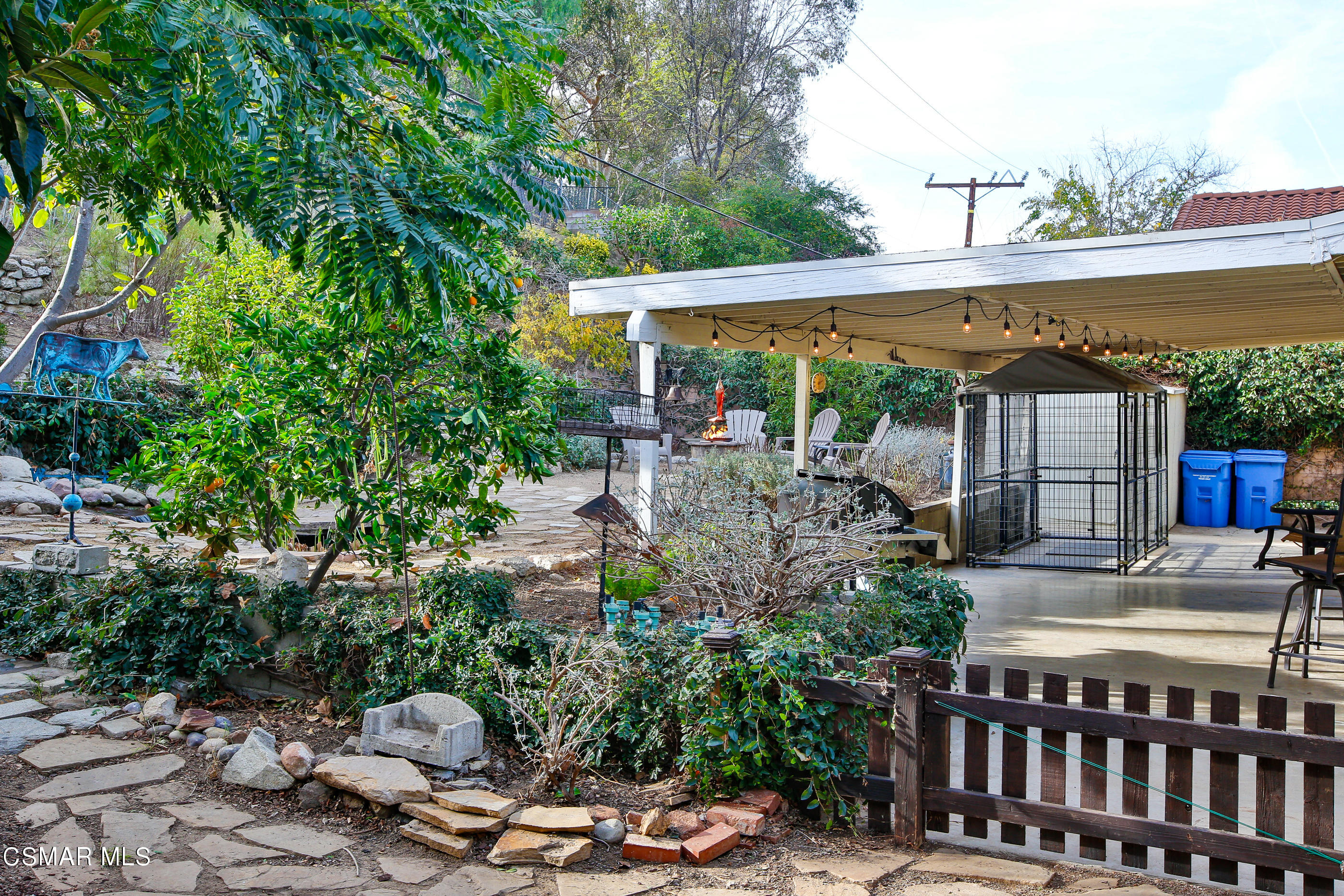 807 Talbert Avenue Simi Valley, CA 93065 - Photo 27 of 33 a view of a patio with table and chairs under an umbrella