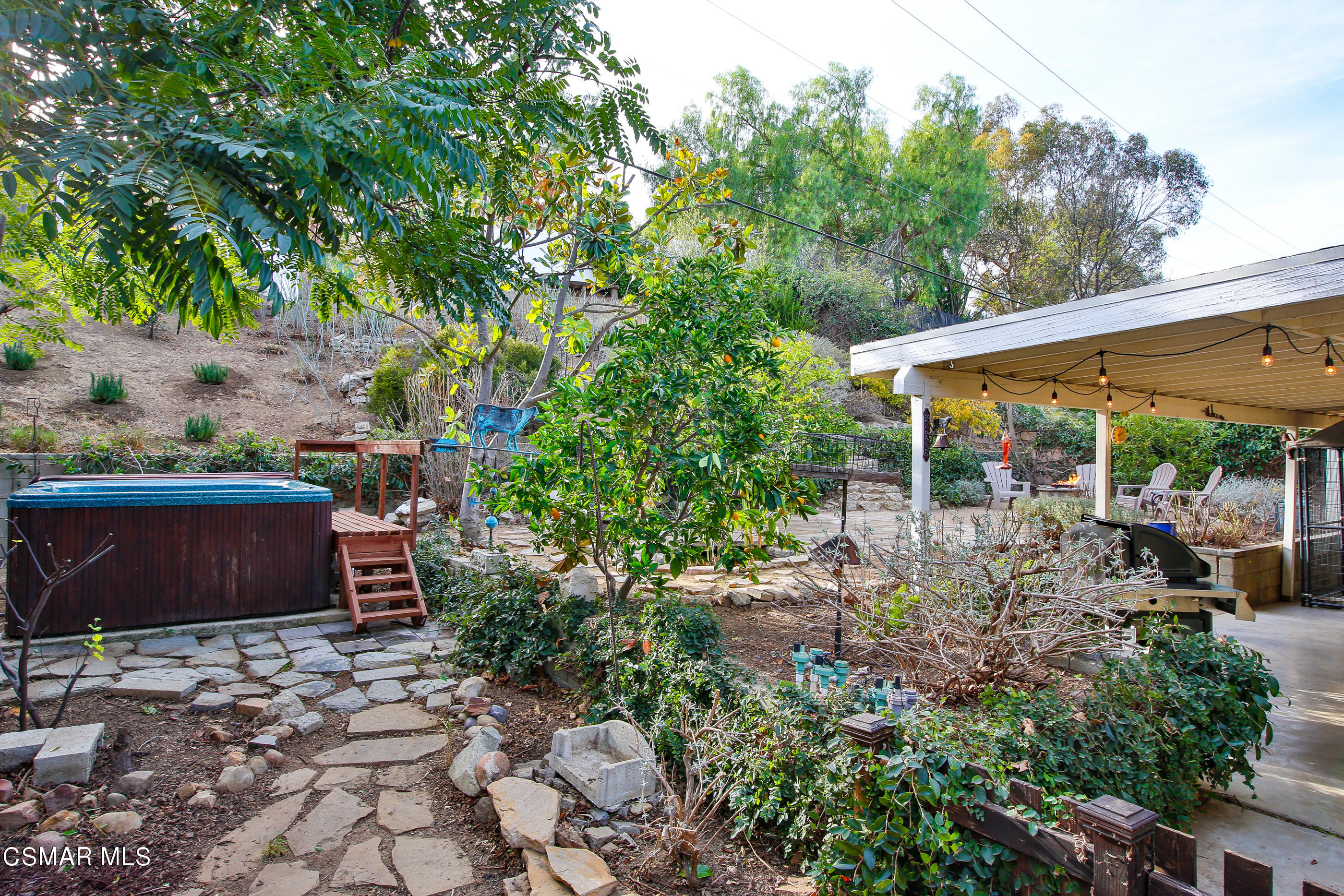 807 Talbert Avenue Simi Valley, CA 93065 - Photo 28 of 33 a view of a patio with table and chairs potted plants and large tree