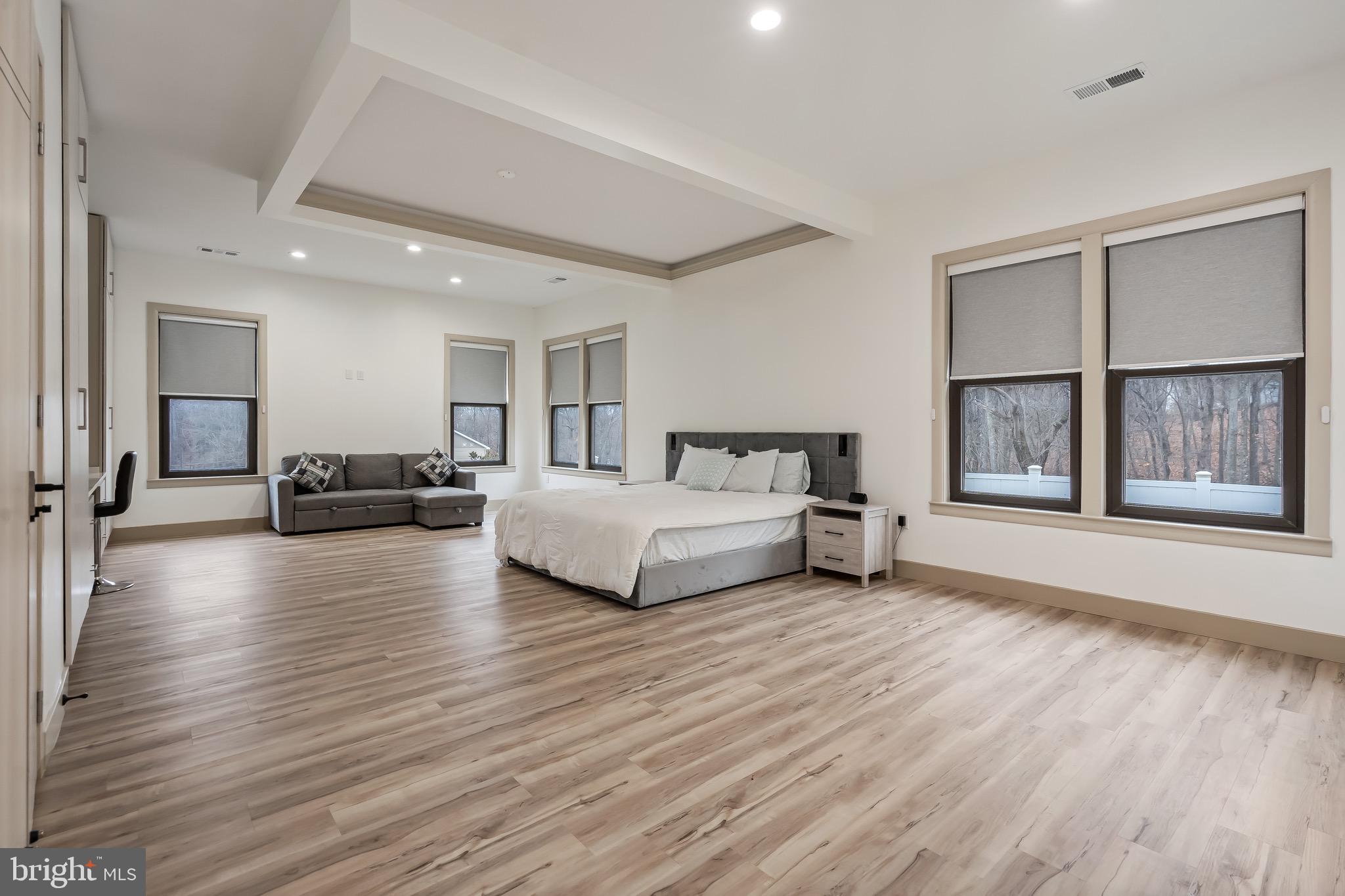 24035 New Mountain Road Aldie, VA 20105 - Photo 64 of 118 a spacious bedroom with a large bed and a large window