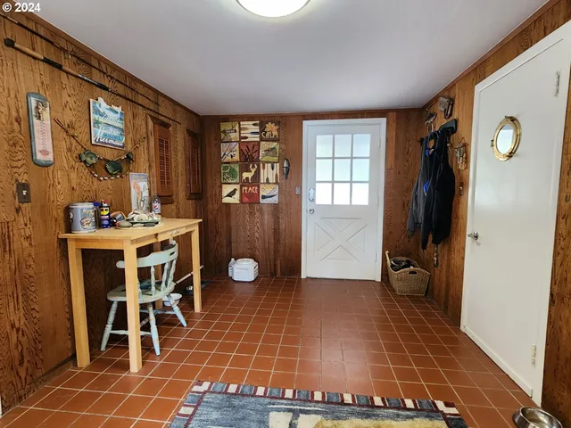 a room with furniture a flat screen tv and a window