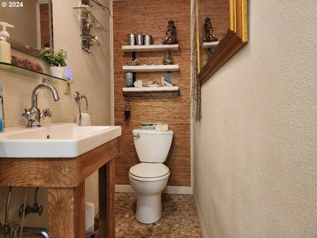 a bathroom with a toilet and a sink