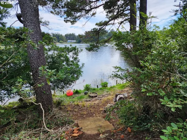 an aerial view of house with yard swimming pool and outdoor seating