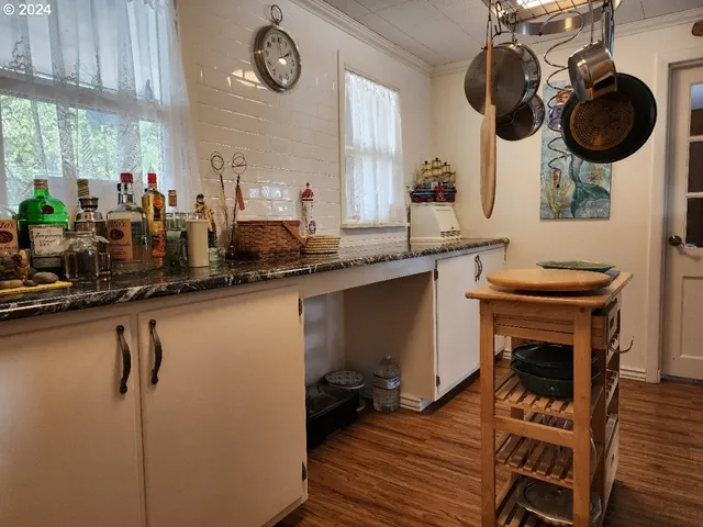 a kitchen with a sink and cabinets
