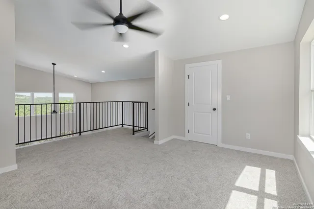 a view of balcony with wooden floor and fence