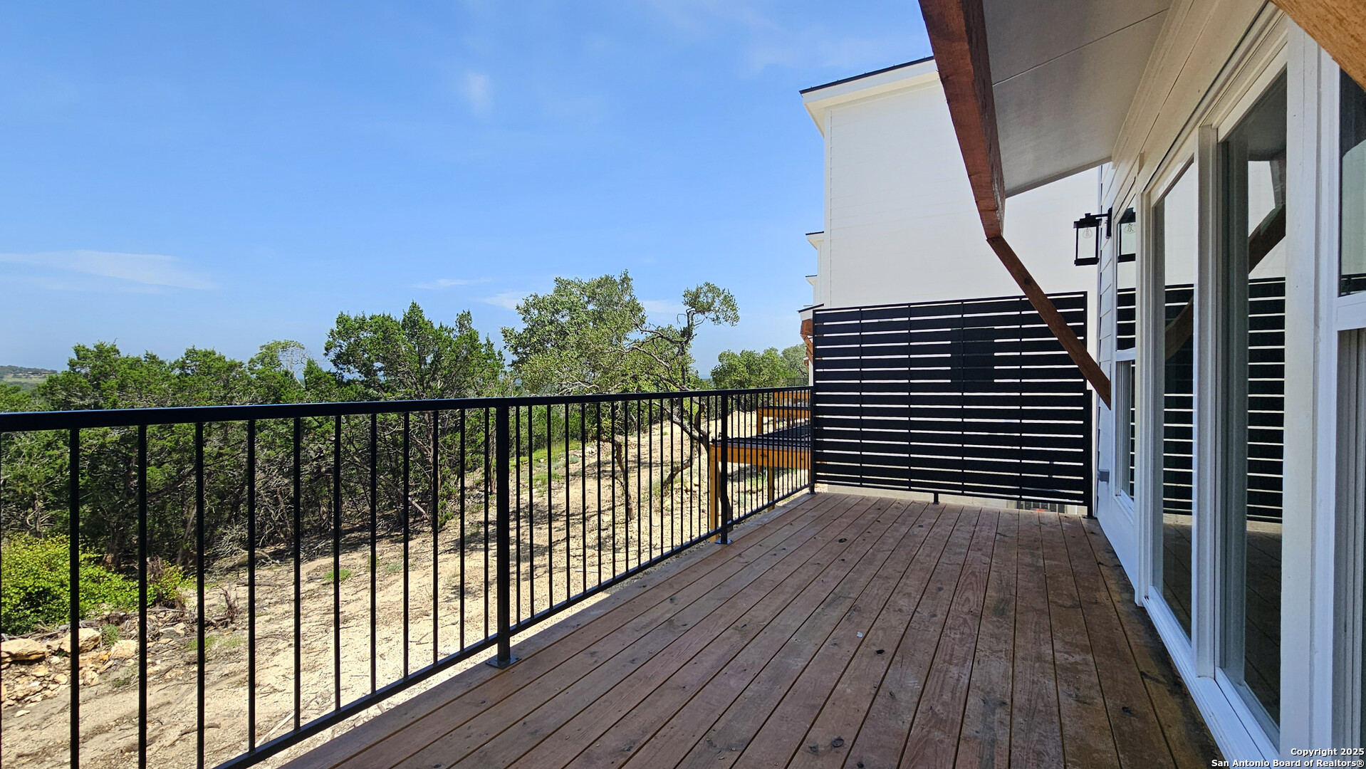 2004 Cedar Hill Drive, Unit 5 Spring Branch, TX 78070 - Photo 17 of 27 a view of balcony with wooden floor