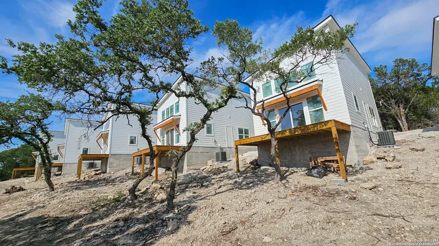 an aerial view of a house with outdoor space and street view