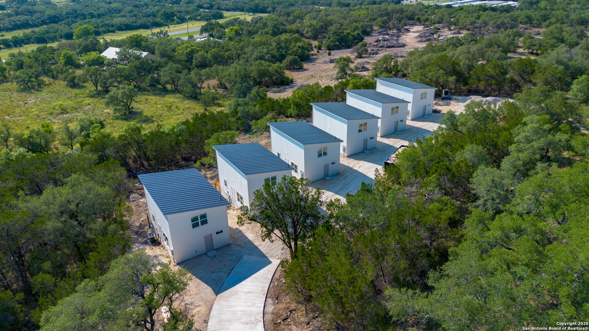2004 Cedar Hill Drive, Unit 5 Spring Branch, TX 78070 - Photo 22 of 27 an aerial view of a house with outdoor space and street view